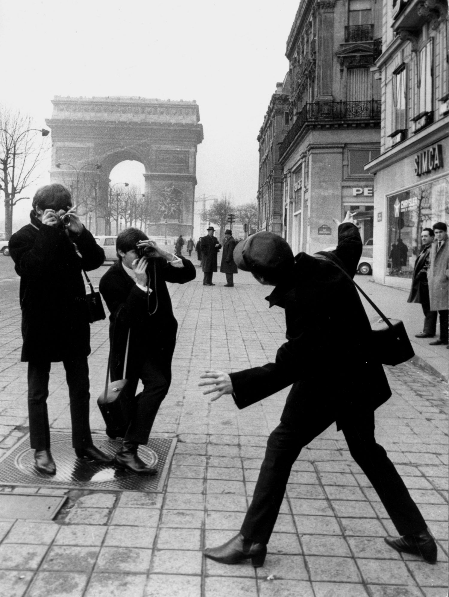 The Beatles in Paris : John Lennon Photographed By George Harrison and Paul McCartney on Champs Elysees in Paris January 15, 1964  by bridgeman Images  on GIANT ART - black and white photography